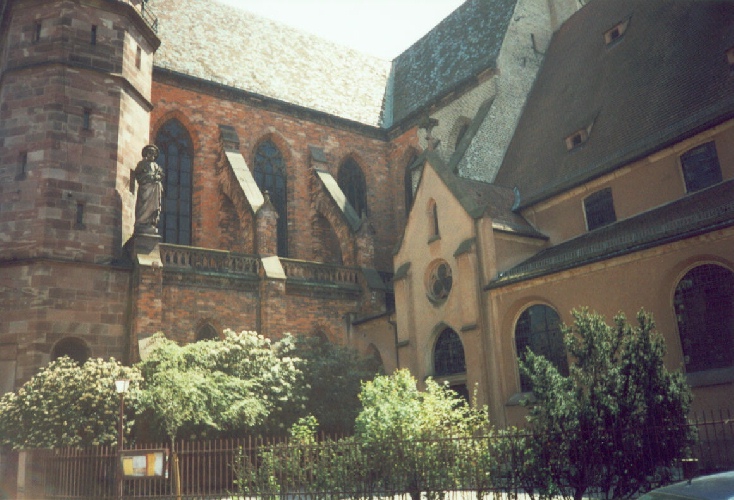 One building, two vastly different religious beliefs--protestants enter for worship in the wing on the right while catholics enter to the left, photograph by C. W. Booth
