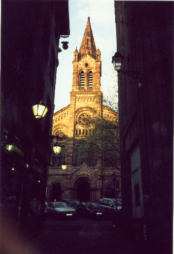 Down any tiny street or alleyway one might encounter a church, such as this protestant church, photograph by C. W. Booth